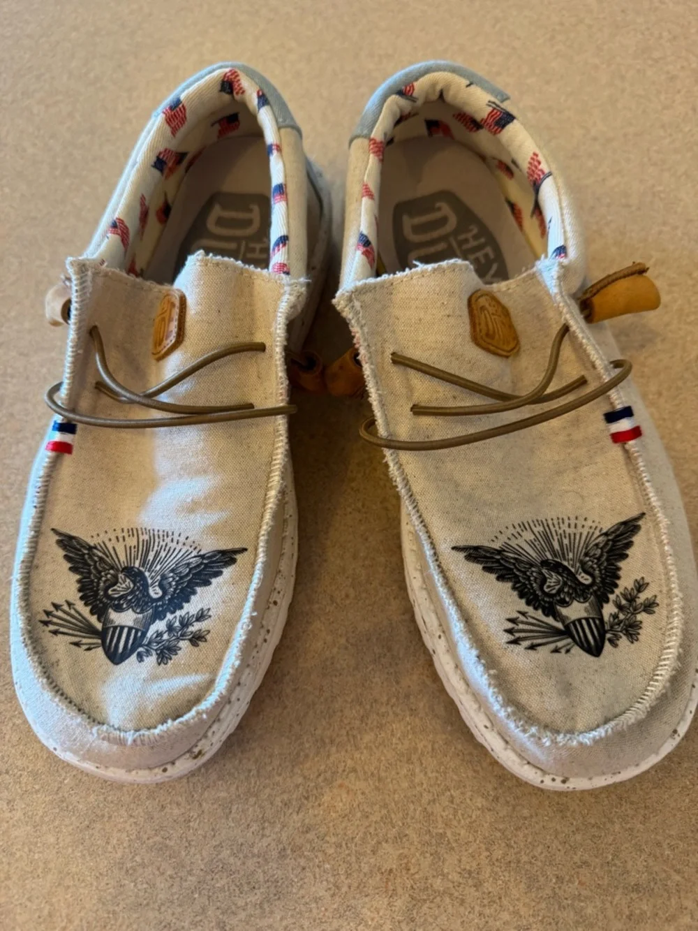 Hey Dude Cream Canvas Boat Shoes with Black Eagle Print